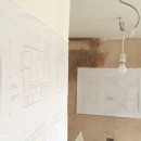 The drawings prepared by the client hung and waiting for action by the builder.